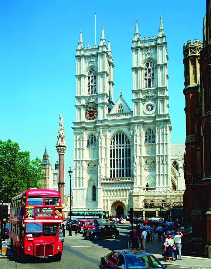 Westminster Abbey with a red London bus in the foreground